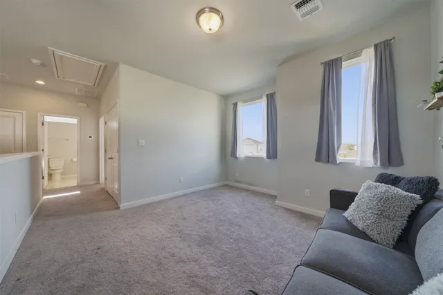 a view of livingroom with furniture and windows