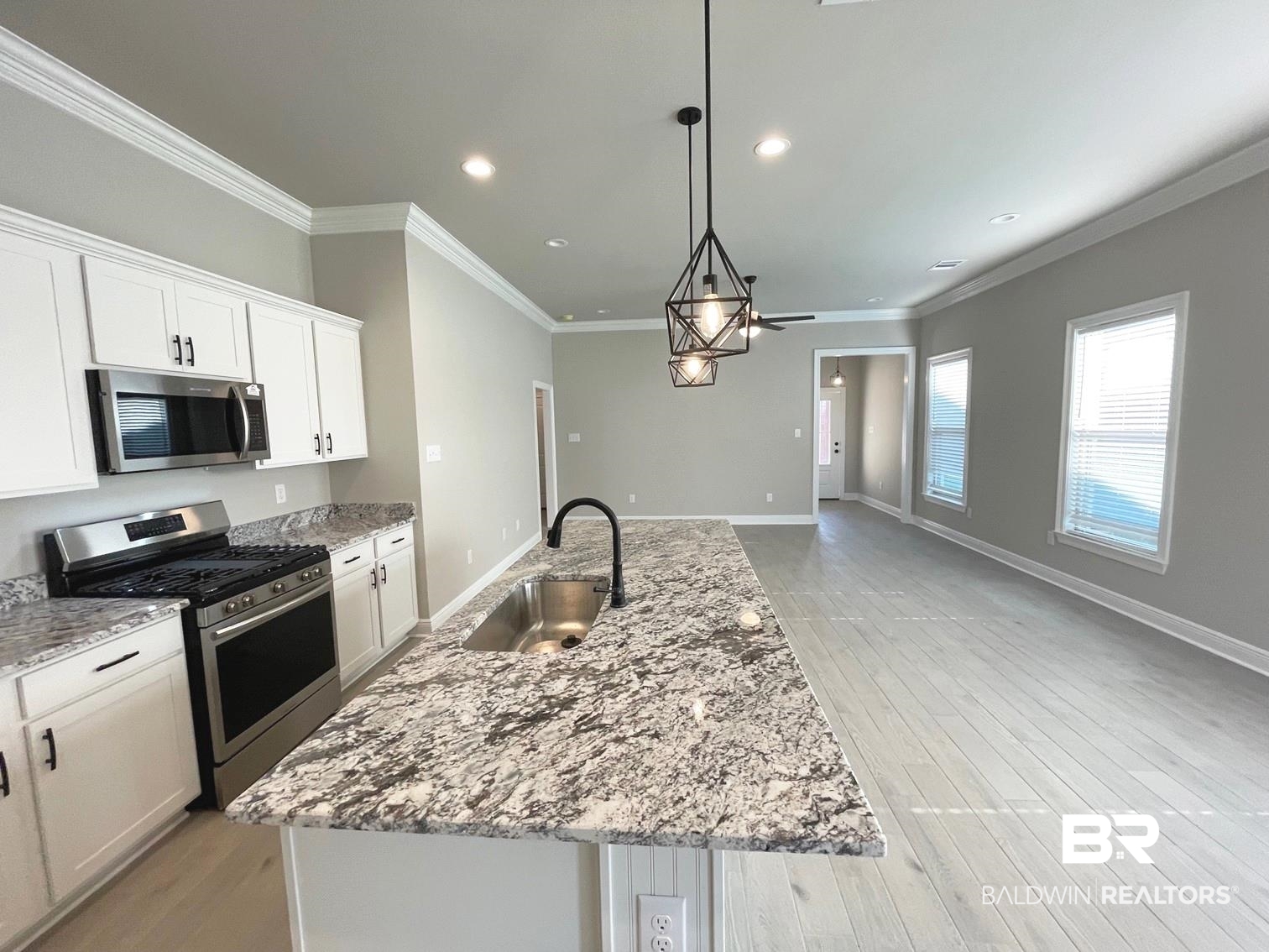 1634 Fenton Circle Foley, AL 36535 - Photo 3 of 14 Kitchen featuring sink, stainless steel appliances, and a center island with sink