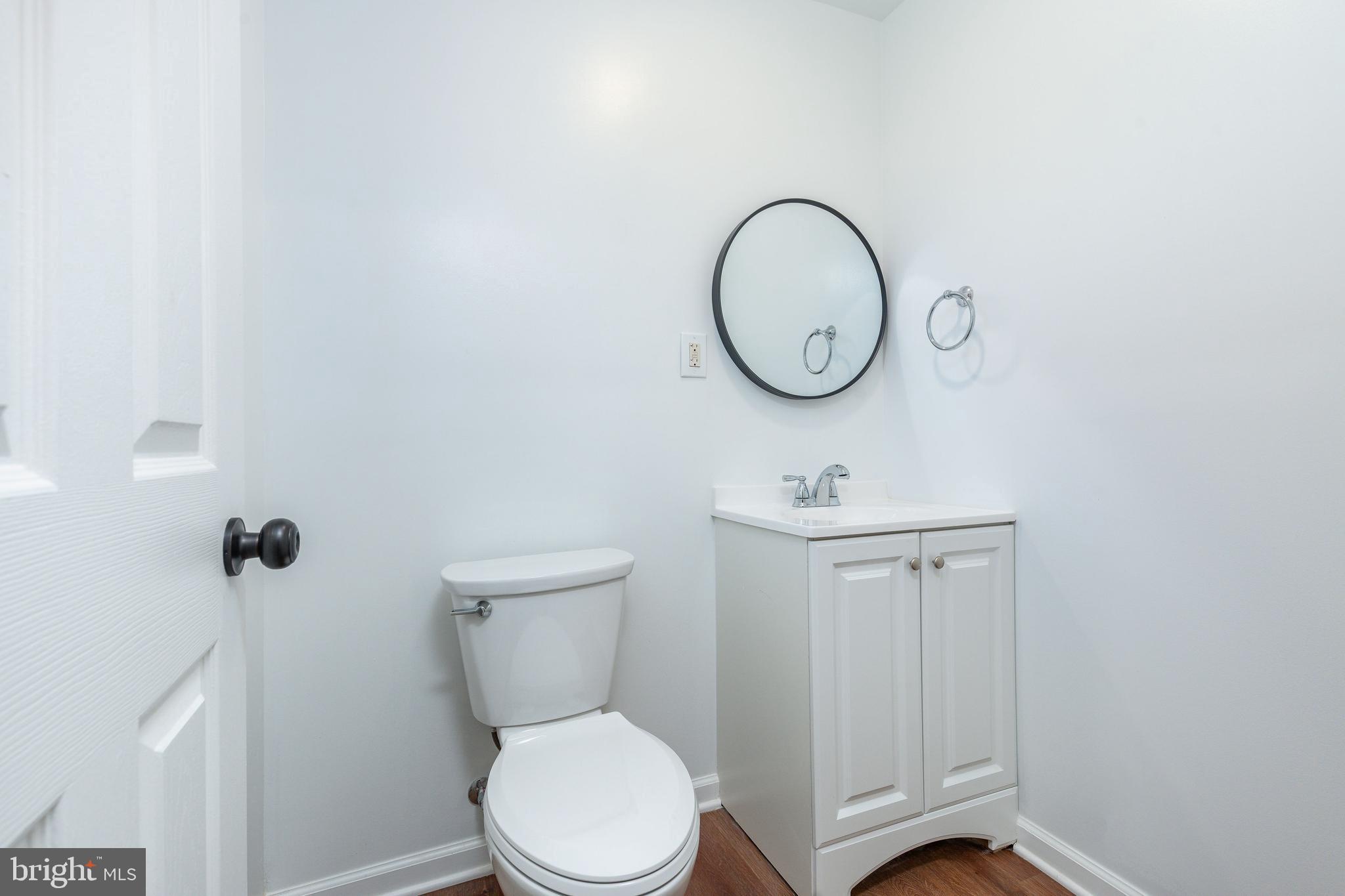 32 East Elm Street Norristown, PA 19401 - Photo 21 of 65 a bathroom with a toilet a sink and a mirror