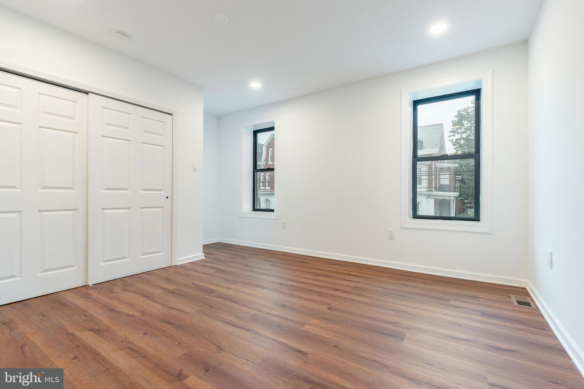 32 East Elm Street Norristown, PA 19401 - Photo 24 of 65 a view of an empty room with wooden floor and a window