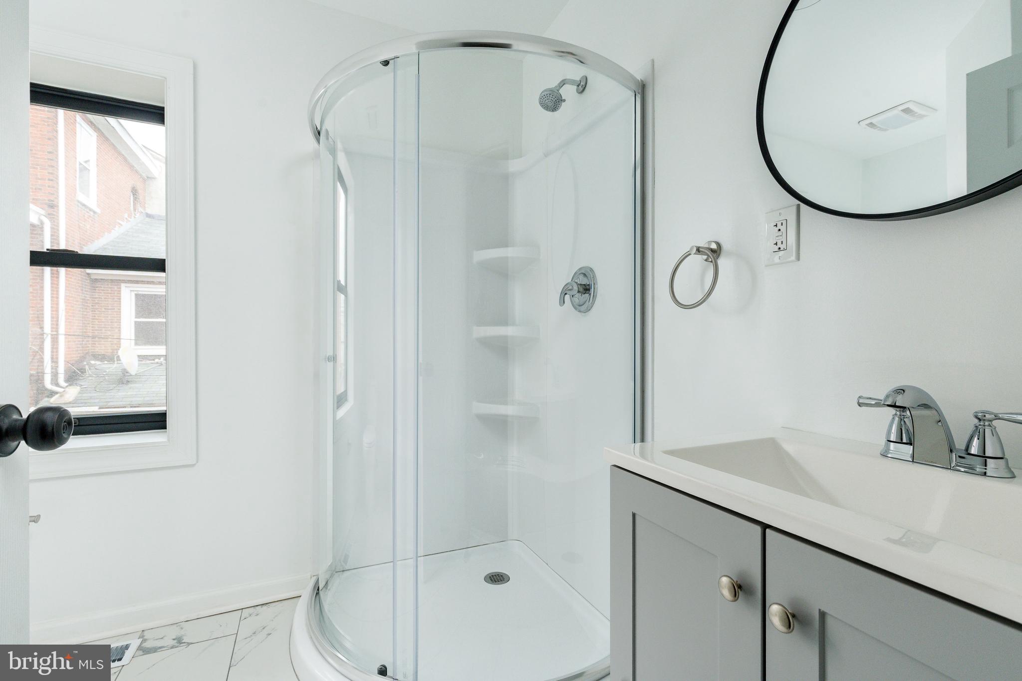 32 East Elm Street Norristown, PA 19401 - Photo 28 of 65 a bathroom with a sink and a mirror