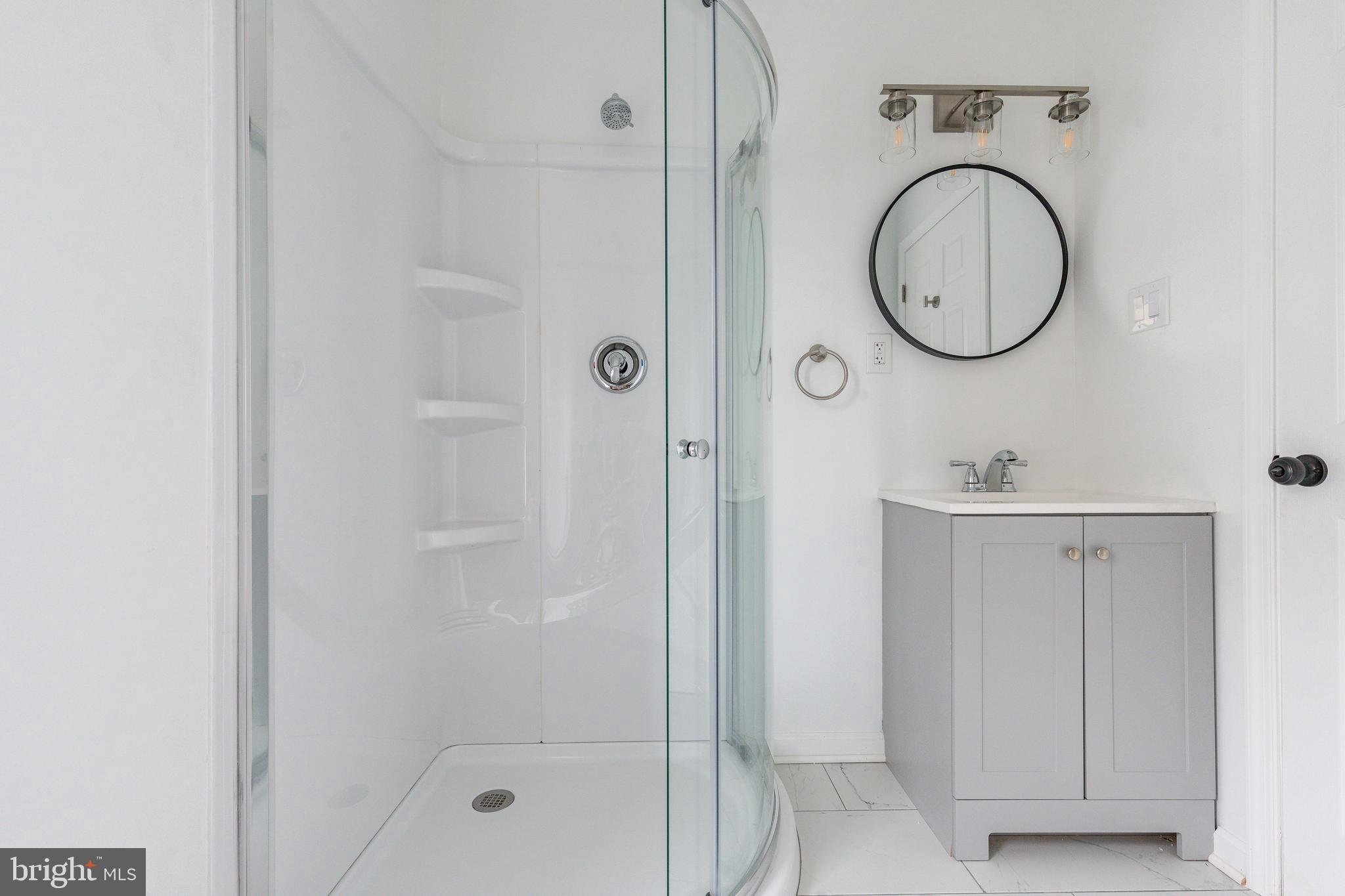 32 East Elm Street Norristown, PA 19401 - Photo 29 of 65 a bathroom with a sink and a mirror