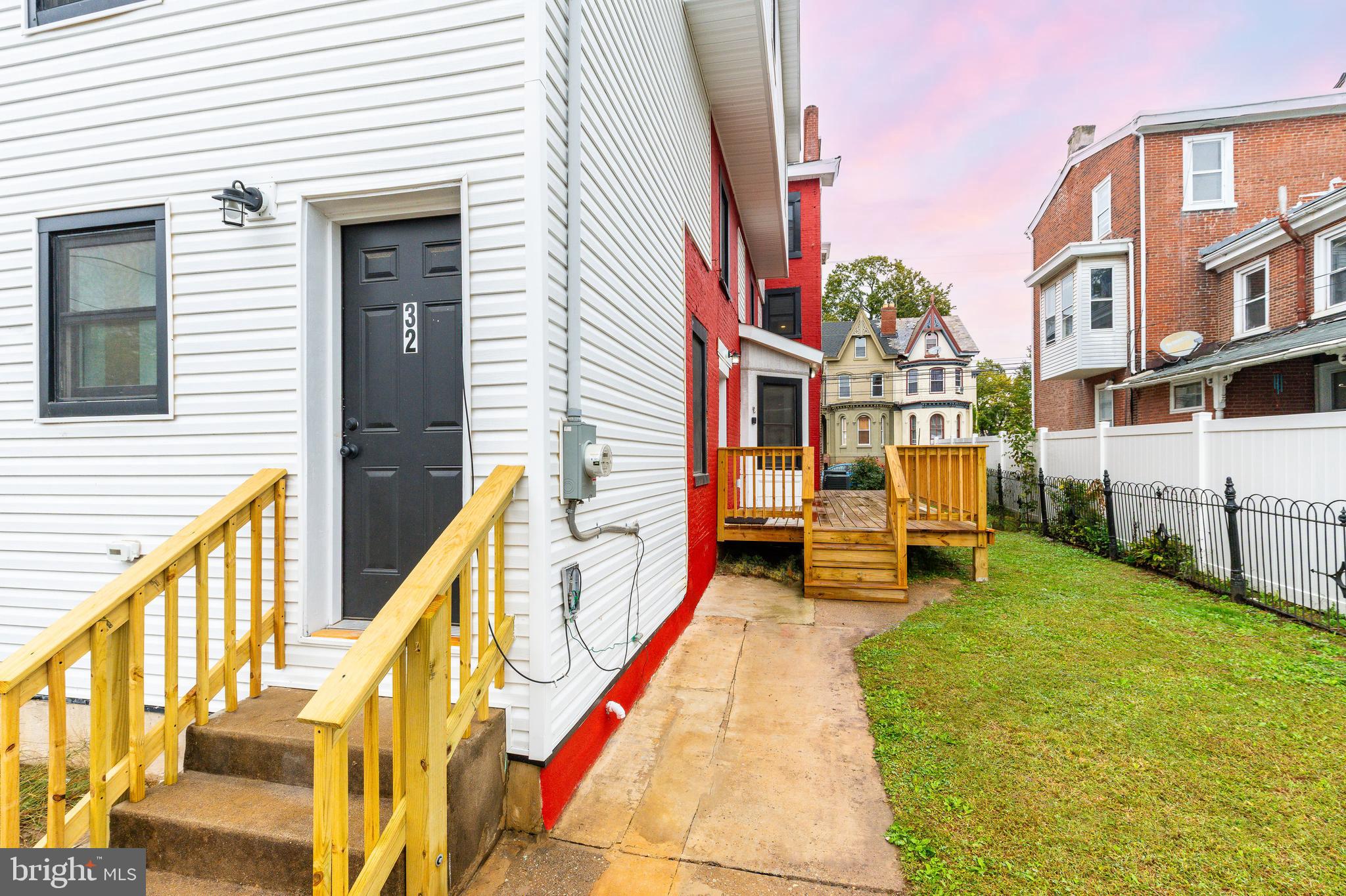 32 East Elm Street Norristown, PA 19401 - Photo 53 of 65 a front view of a house with swimming pool and sitting space