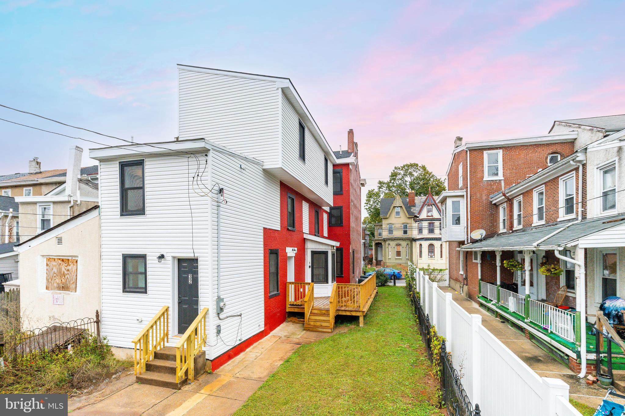 32 East Elm Street Norristown, PA 19401 - Photo 55 of 65 a view of a building with large windows and a small yard