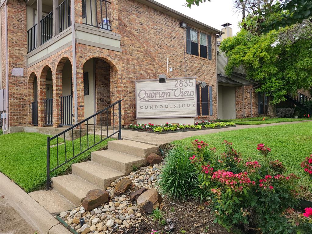2835 Keller Springs Road, Unit 501 Carrollton, TX 75006 - Photo 1 of 1 a front view of a house with a garden and pathway