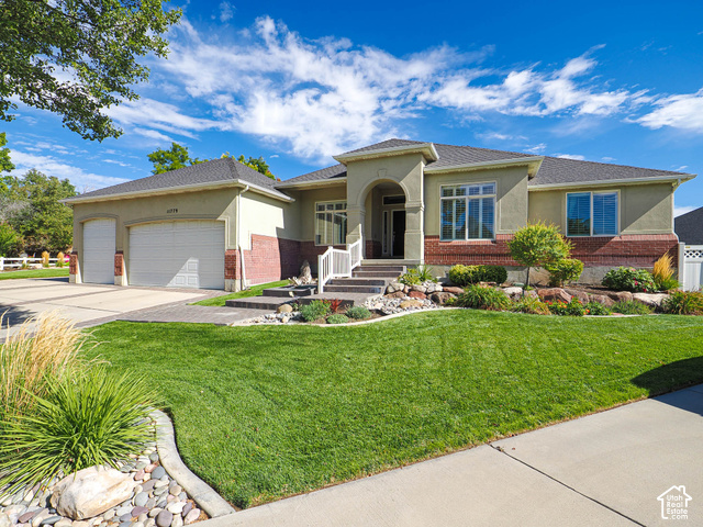 11779 South Stone Ridge Court Ridge West Riverton, UT 84065 - Photo 1 of 85 Stucco exterior with brick accents, two-car garage, concrete driveway, front lawn, and landscaped garden beds