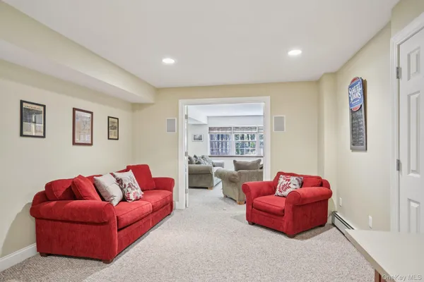 a living room with furniture a large window and a couch