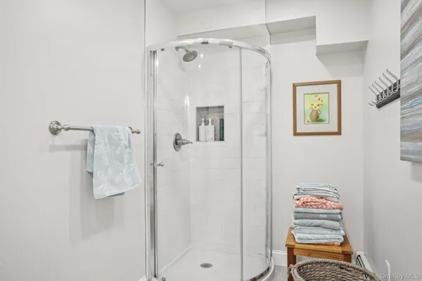 a bathroom with a shower and a sink