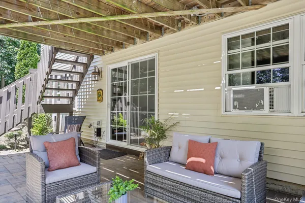 a outdoor living space with furniture and a potted plant