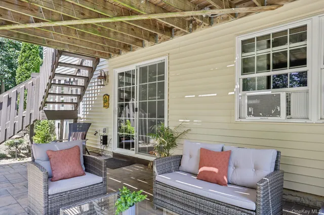 a outdoor living space with furniture and a potted plant