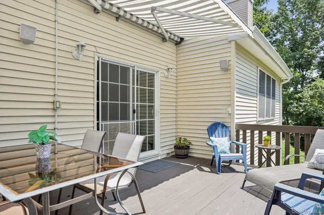 a view of a patio with couple of chairs