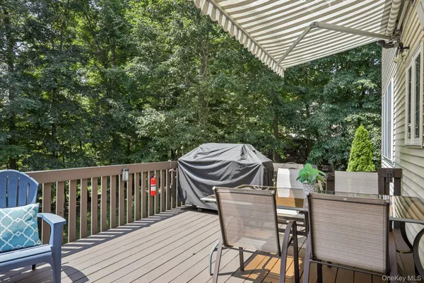 a view of a table and chairs on the roof deck