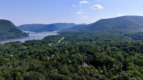 a view of a lush green hillside and a houses