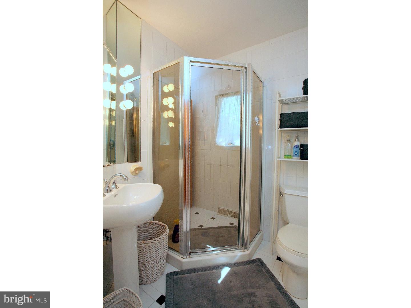 105 Canterbury Road Mount Laurel, NJ 08054 - Photo 14 of 25 a bathroom with a sink a toilet and shower