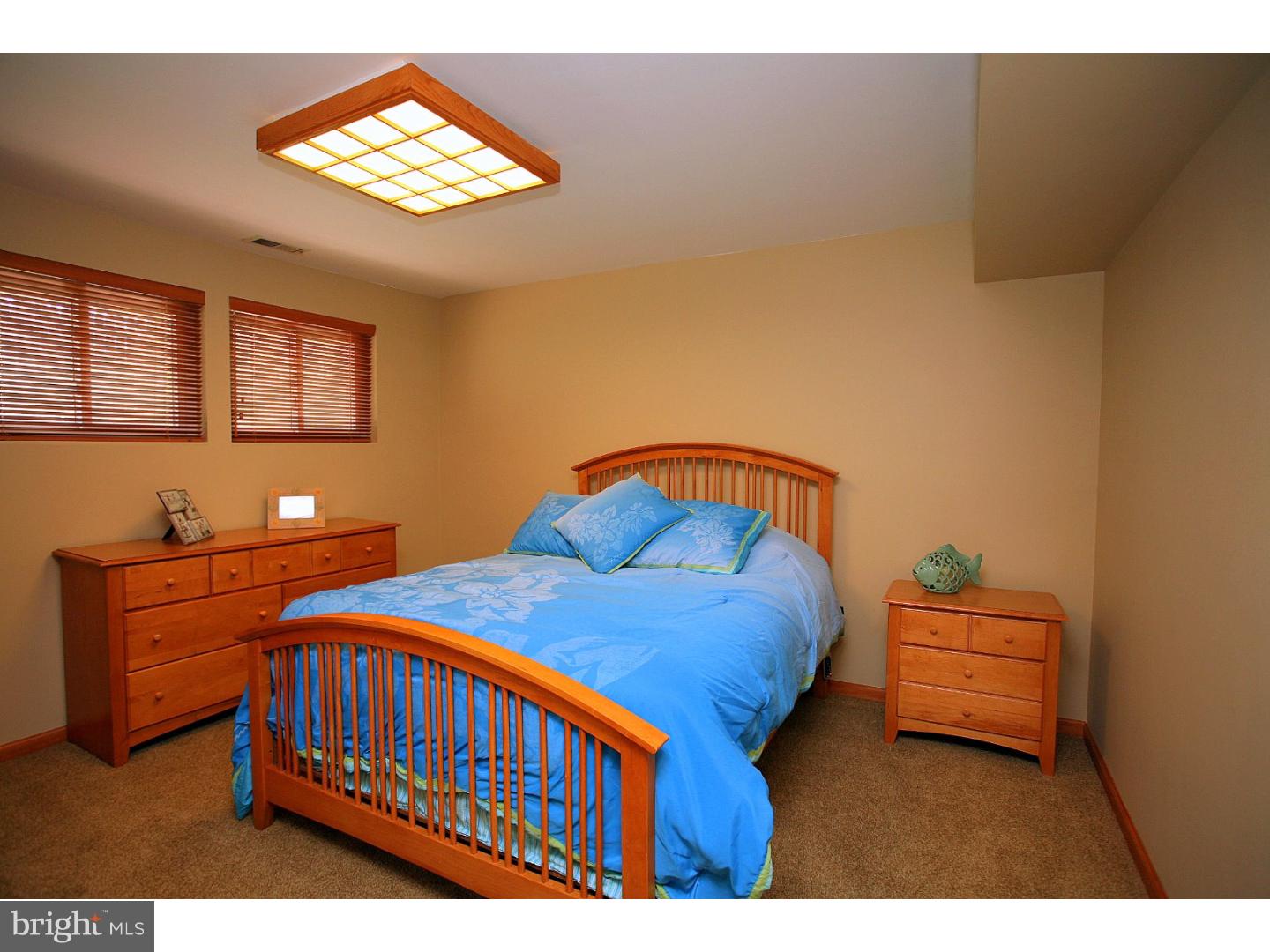 105 Canterbury Road Mount Laurel, NJ 08054 - Photo 22 of 25 a bedroom with a bed and a chandelier
