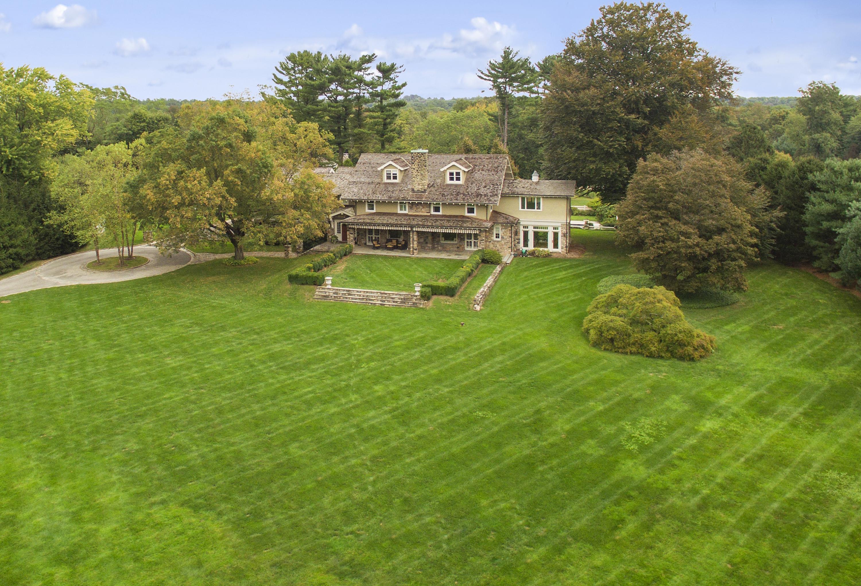 1081 Ponus Ridge Road New Canaan, CT 06840 - Photo 1 of 37 a aerial view of a house with a big yard
