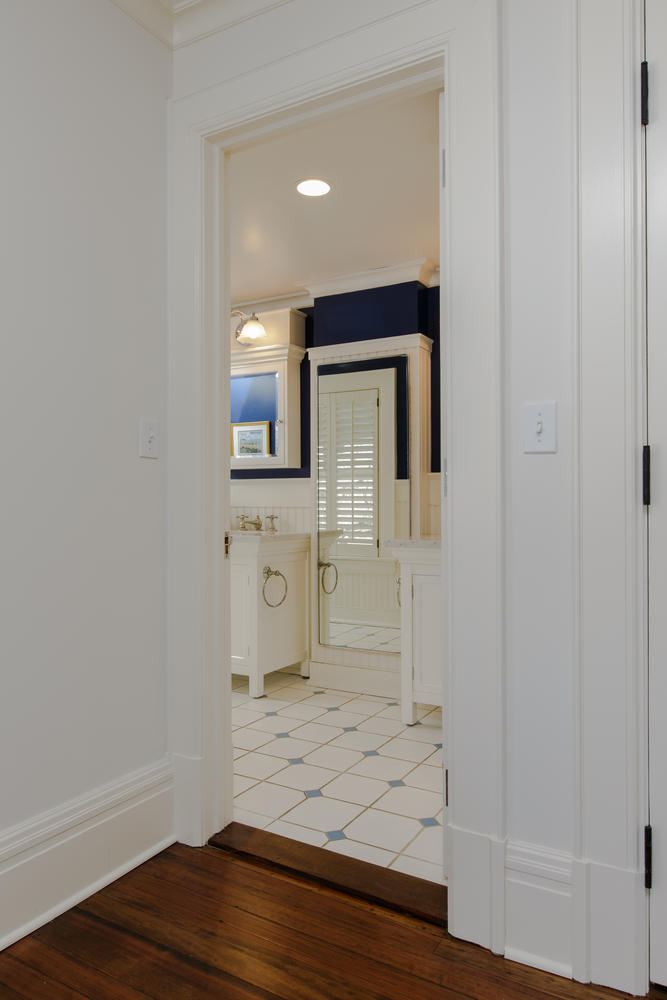 1081 Ponus Ridge Road New Canaan, CT 06840 - Photo 24 of 37 a view of a bathroom from a hallway
