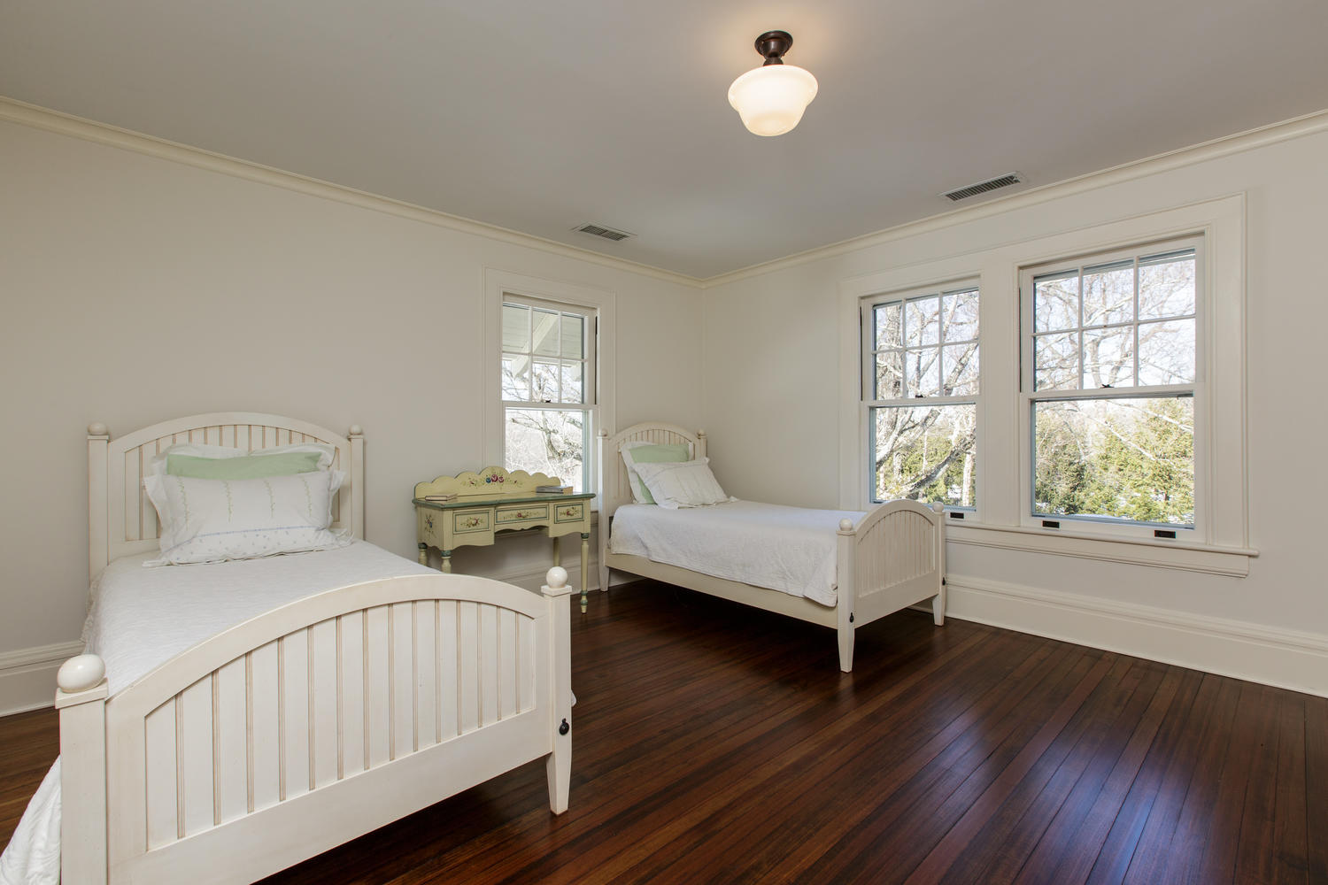 1081 Ponus Ridge Road New Canaan, CT 06840 - Photo 25 of 37 a bedroom with two beds and wooden floor
