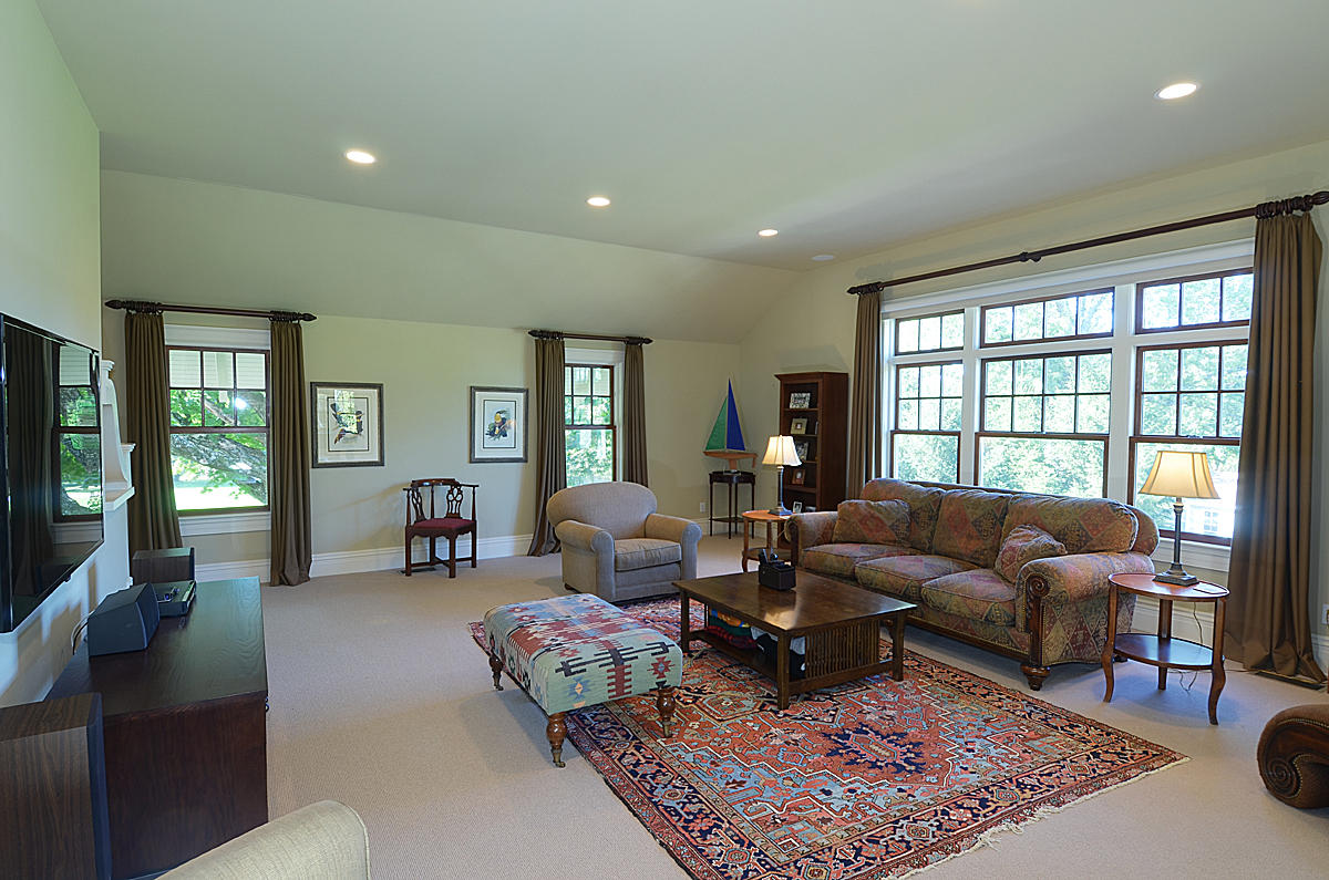1081 Ponus Ridge Road New Canaan, CT 06840 - Photo 28 of 37 a living room with furniture and a rug