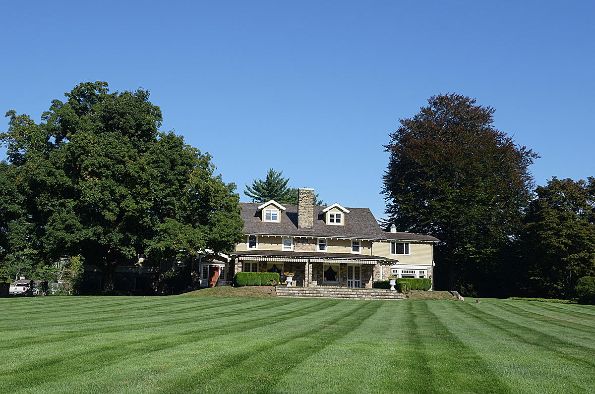 1081 Ponus Ridge Road New Canaan, CT 06840 - Photo 30 of 37 a view of a house with a yard