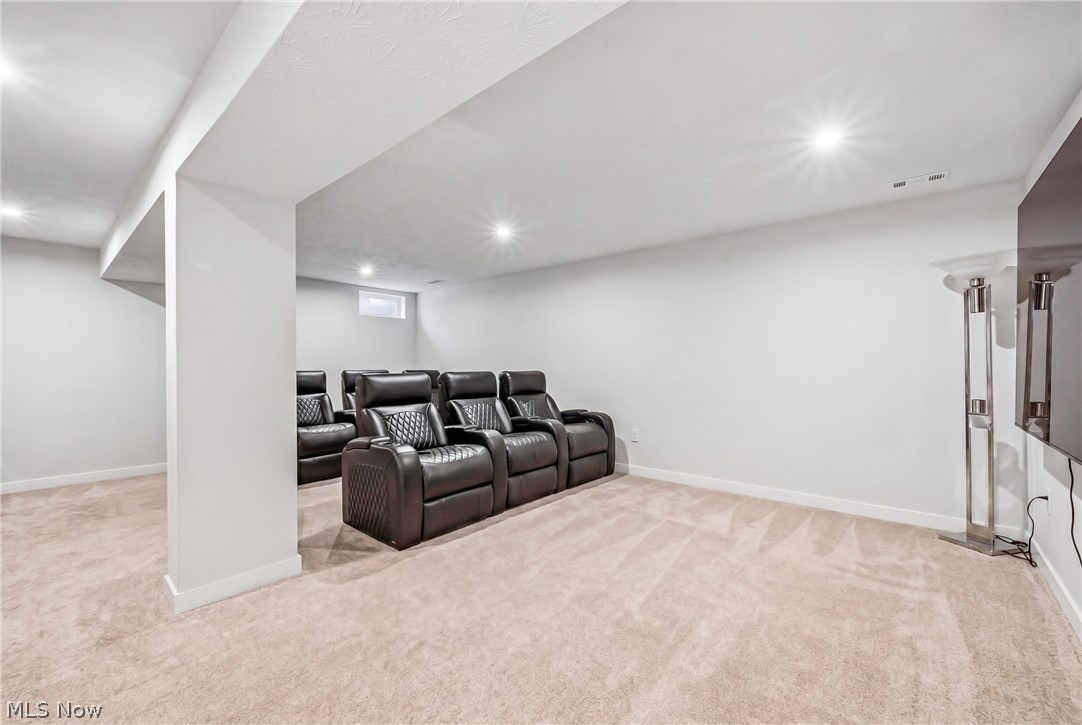 5358 Walnut Rdg Lane Sheffield Lake, OH 44054 - Photo 37 of 50 Spacious room featuring neutral carpeting, recessed ceiling lighting, a partial egress window, and white baseboards