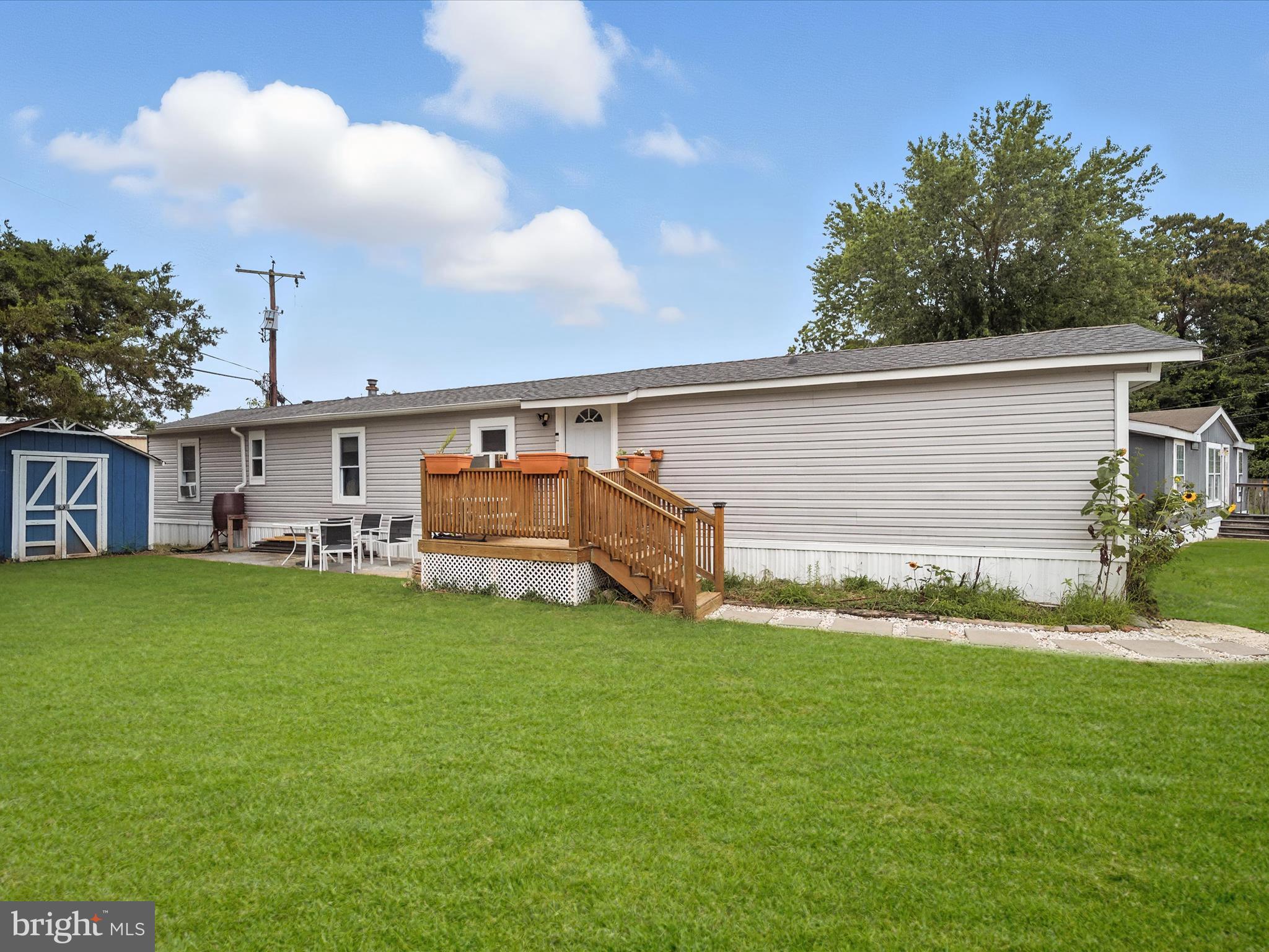 6 Patuxent Mobile Estates Lothian, MD 20711 - Photo 1 of 15 a view of a backyard with a garden