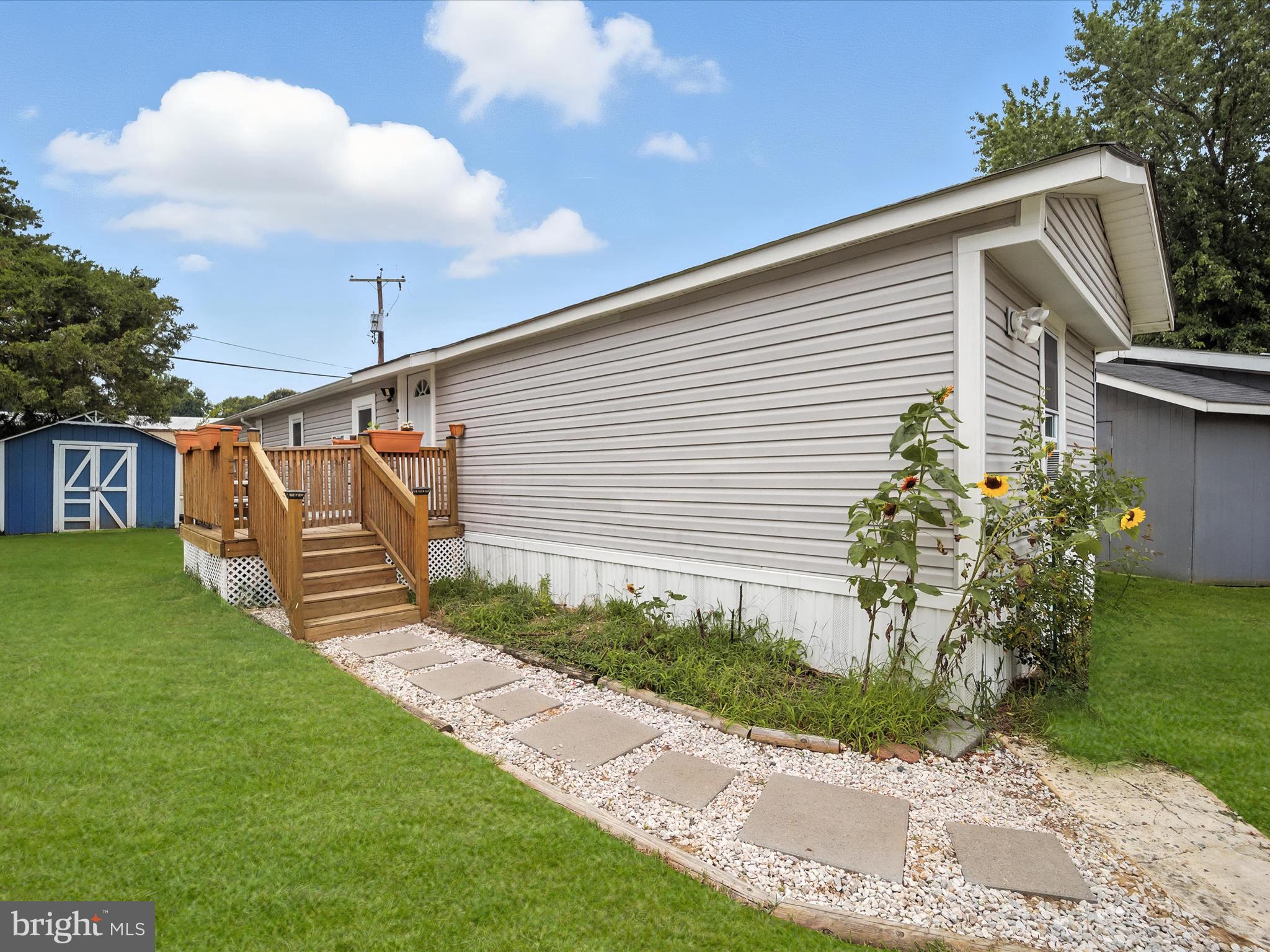 6 Patuxent Mobile Estates Lothian, MD 20711 - Photo 13 of 15 a front view of a house with garden