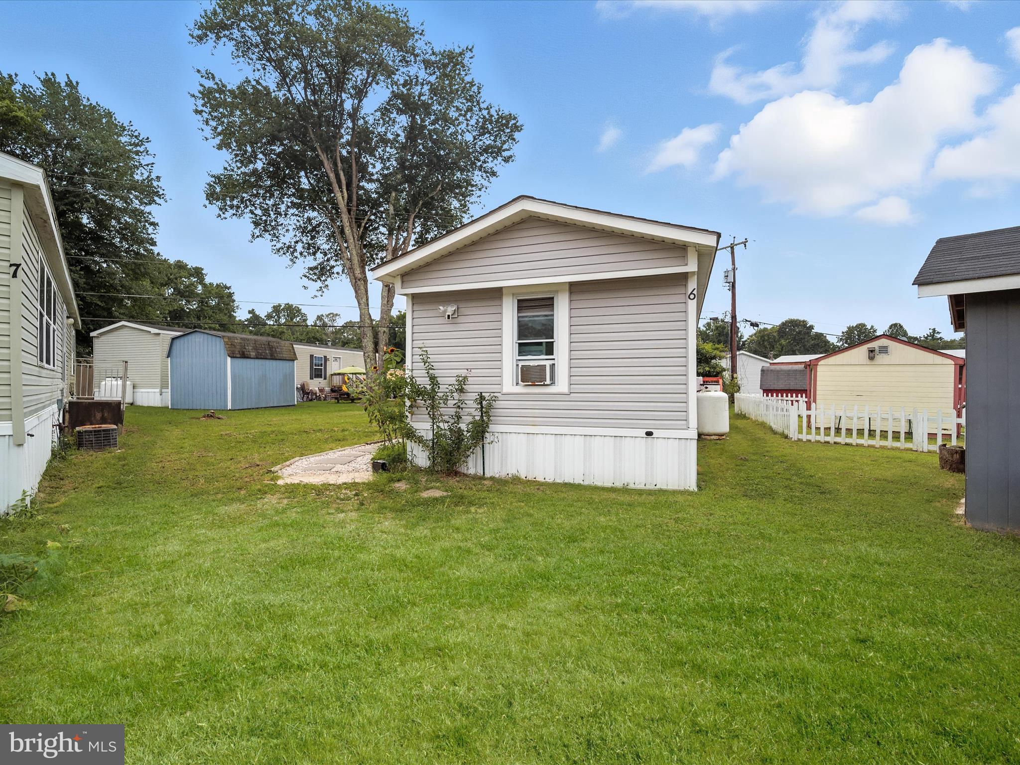 6 Patuxent Mobile Estates Lothian, MD 20711 - Photo 14 of 15 a view of a house with a yard