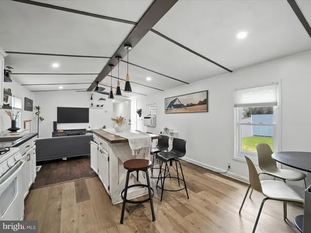 a kitchen with a table and chairs in it