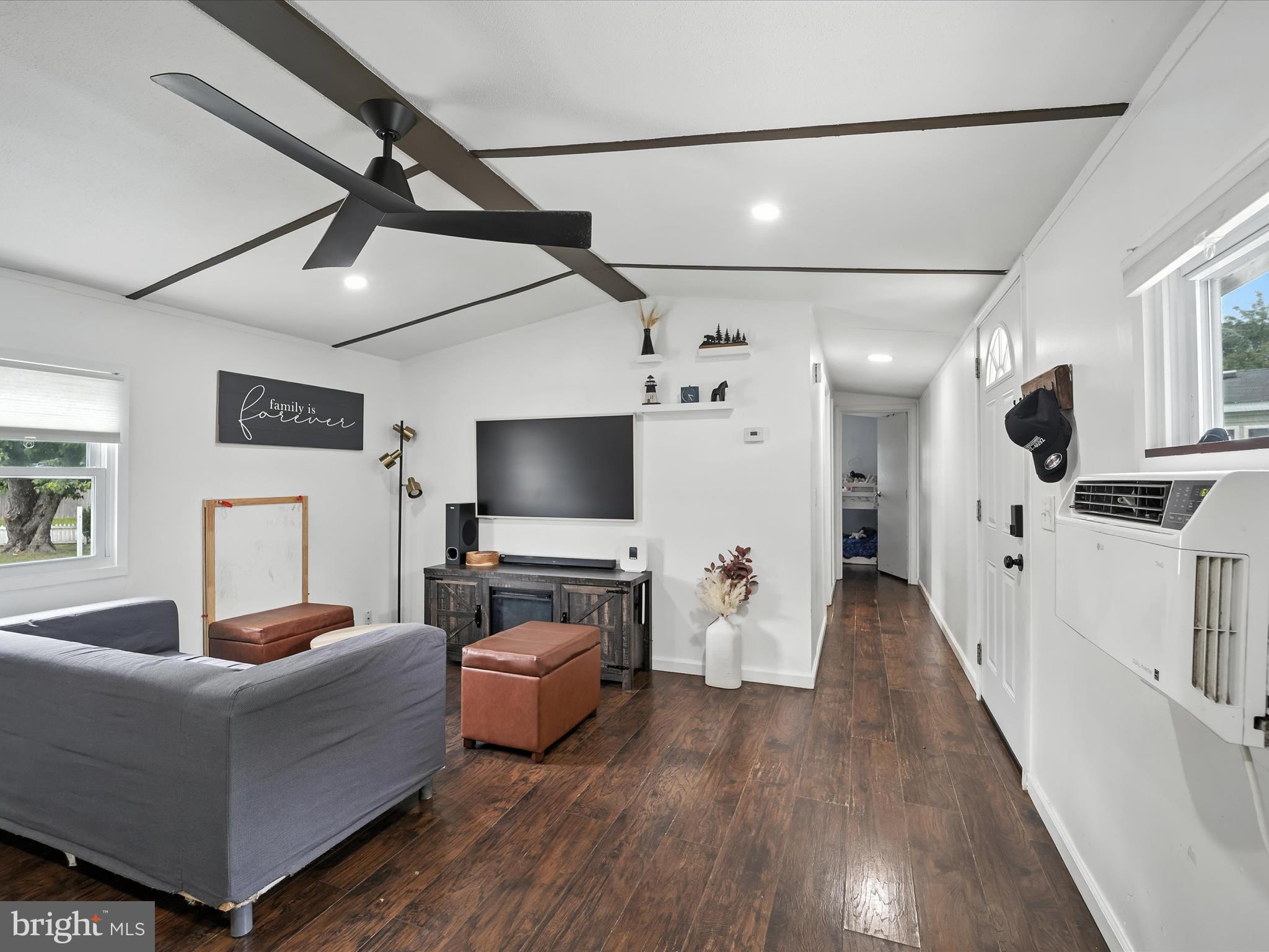 6 Patuxent Mobile Estates Lothian, MD 20711 - Photo 5 of 15 a living room with furniture and a flat screen tv