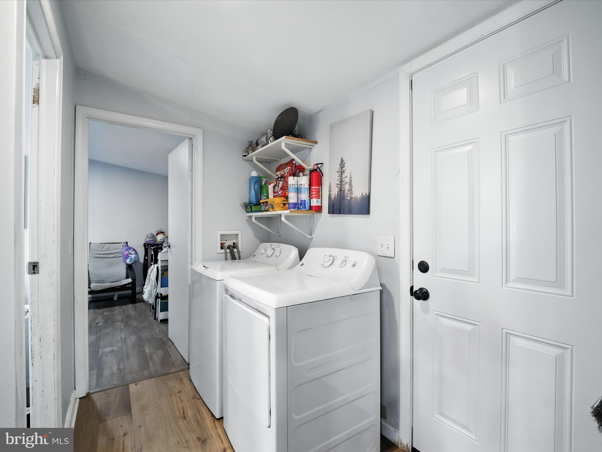 6 Patuxent Mobile Estates Lothian, MD 20711 - Photo 7 of 15 a storage room with washer and dryer