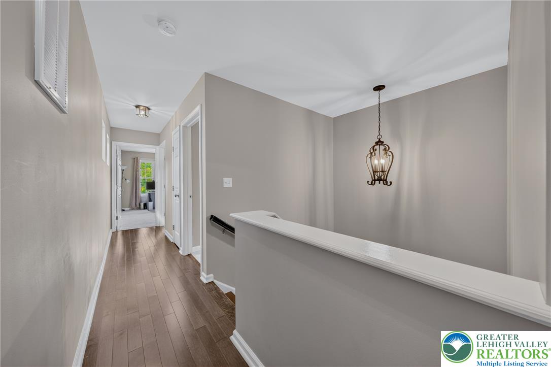 4236 Creek Road Allentown, PA 18104 - Photo 19 of 47 Gleaming hardwood floors guide you through this well-lit upper level hallway.