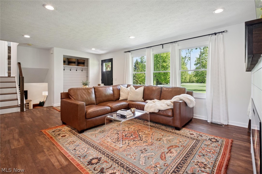 2035 Porter Road Atwater, OH 44201 - Photo 11 of 50 Living room featuring dark hardwood / wood-style floors and a textured ceiling
