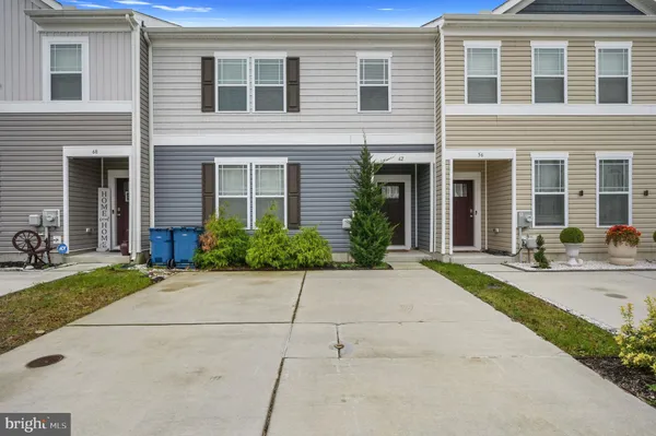 a front view of a house with yard