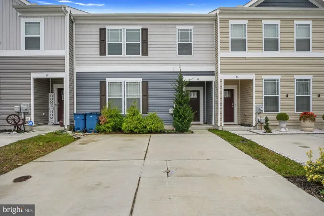 a front view of a house with yard