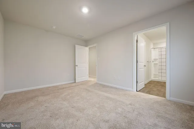 an empty room with closet area