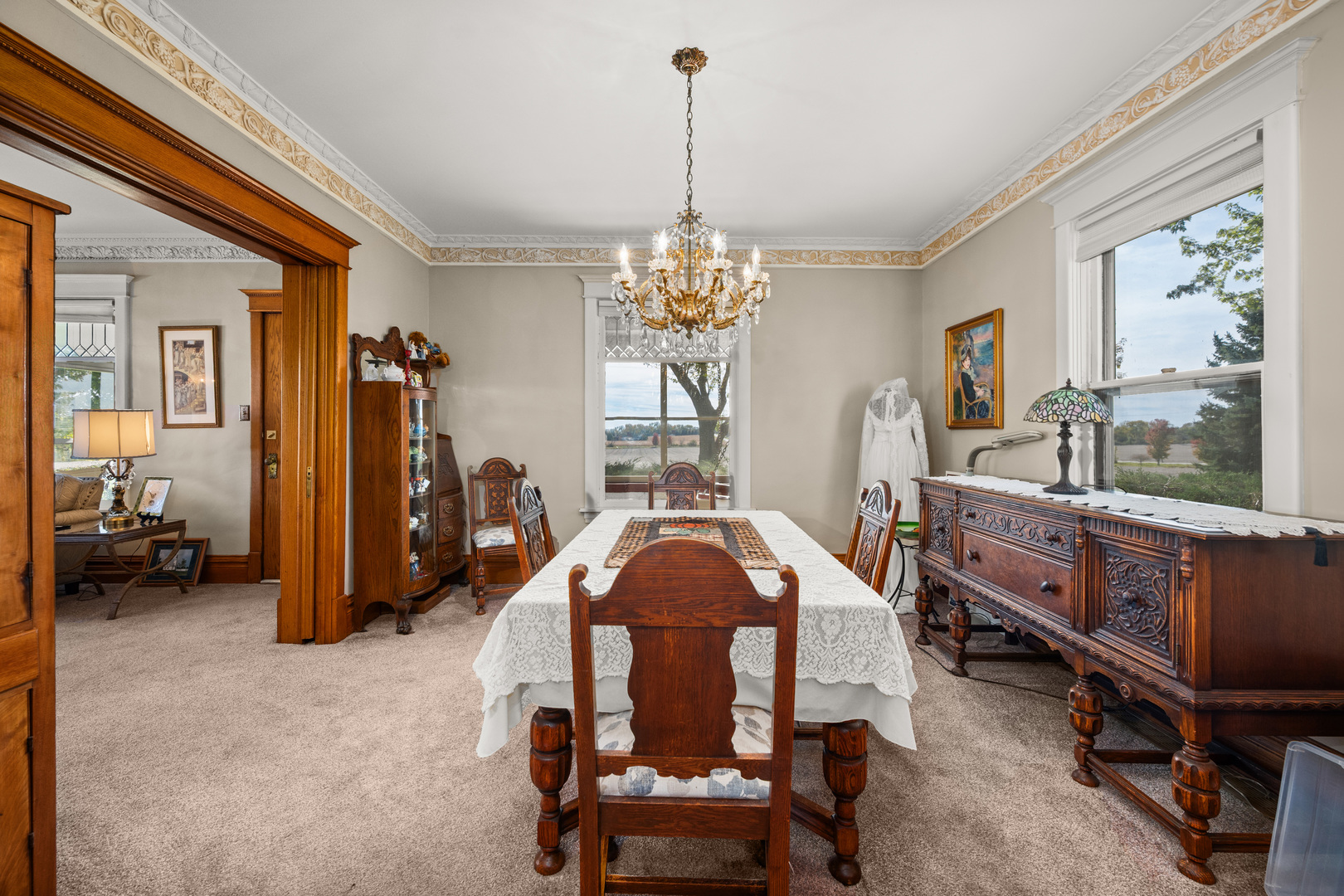 15165 Quigley Road Sycamore, IL 60178 - Photo 12 of 101 a dining room with furniture and a chandelier