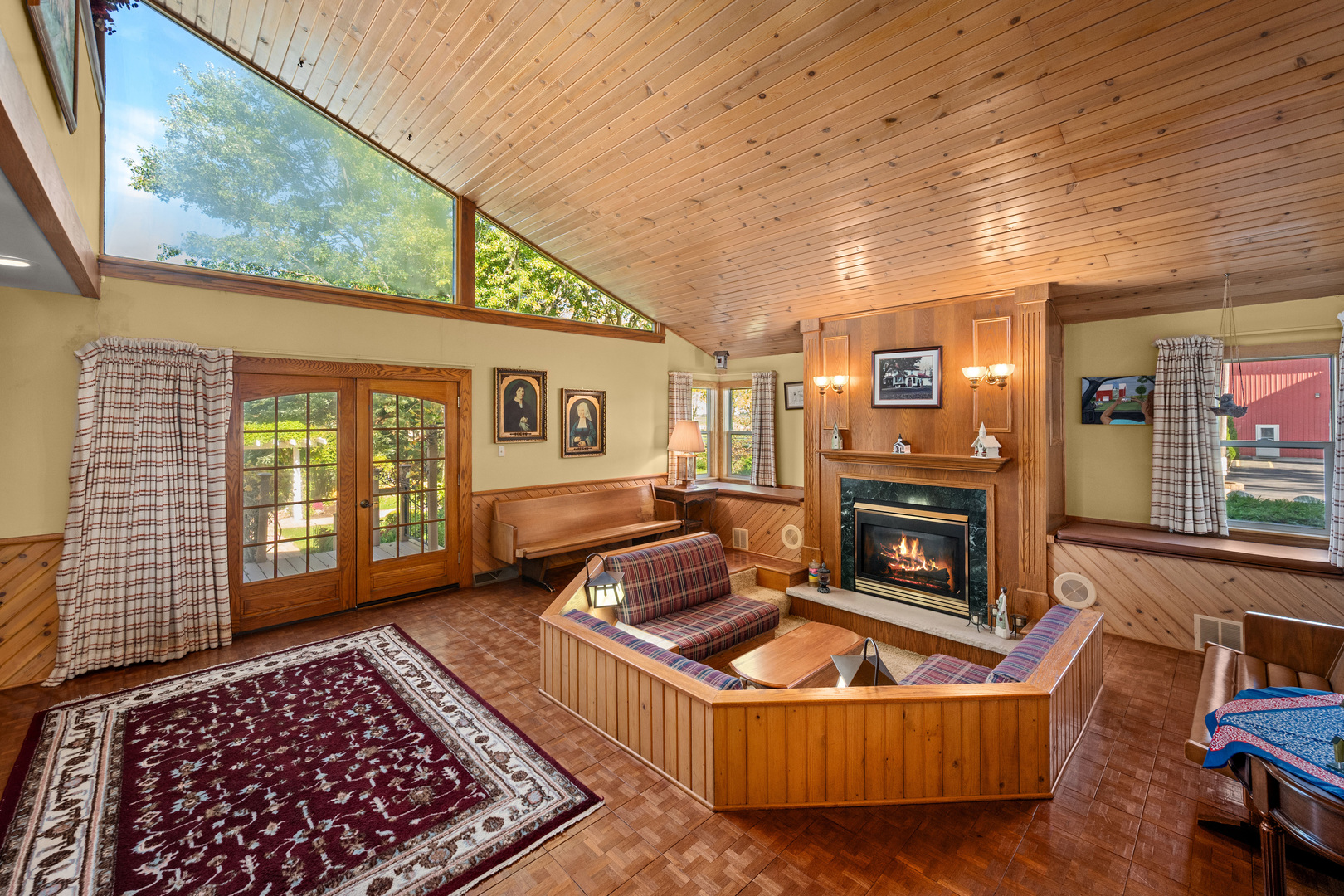 15165 Quigley Road Sycamore, IL 60178 - Photo 18 of 101 a living room with furniture a rug a fireplace and a large window