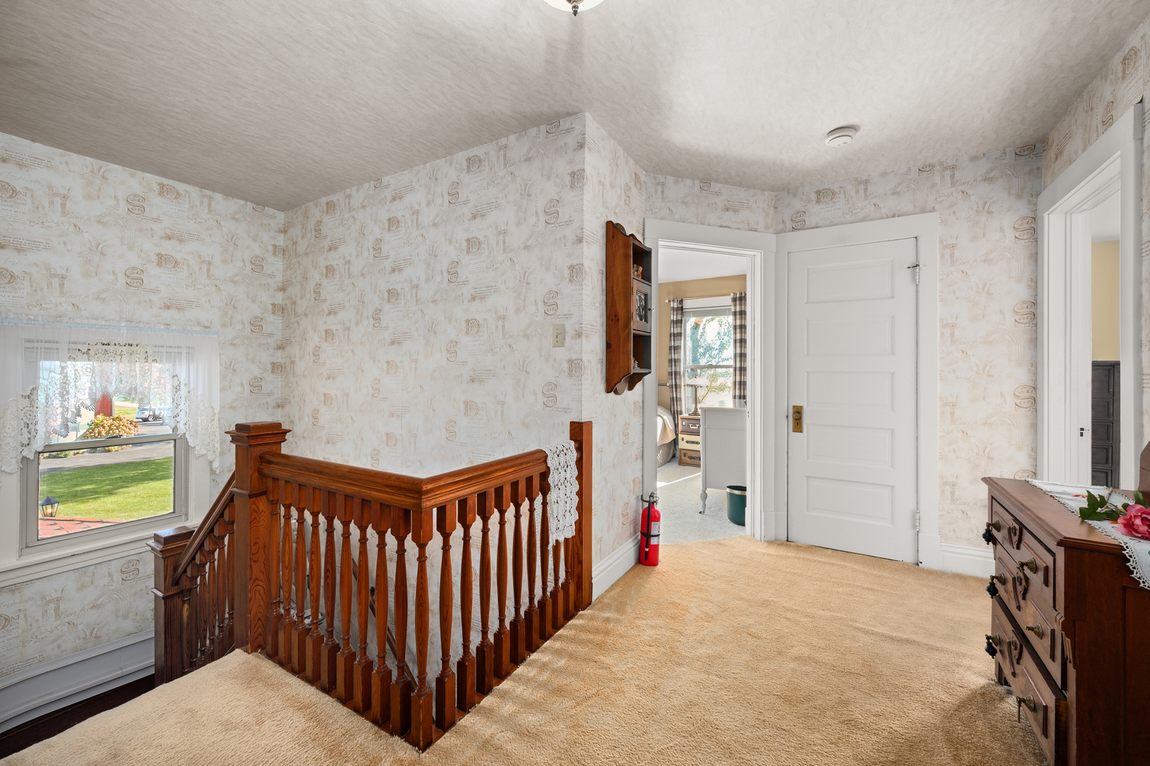 15165 Quigley Road Sycamore, IL 60178 - Photo 25 of 101 a view of a hallway to a livingroom with furniture and window