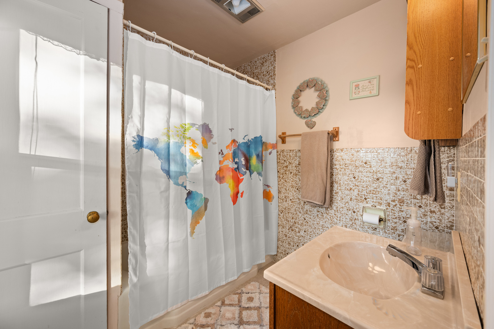 15165 Quigley Road Sycamore, IL 60178 - Photo 30 of 101 a bathroom with a sink a mirror and a shower