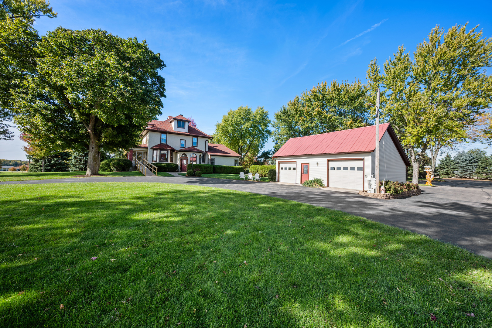 15165 Quigley Road Sycamore, IL 60178 - Photo 3 of 101 a front view of a house with yard and green space