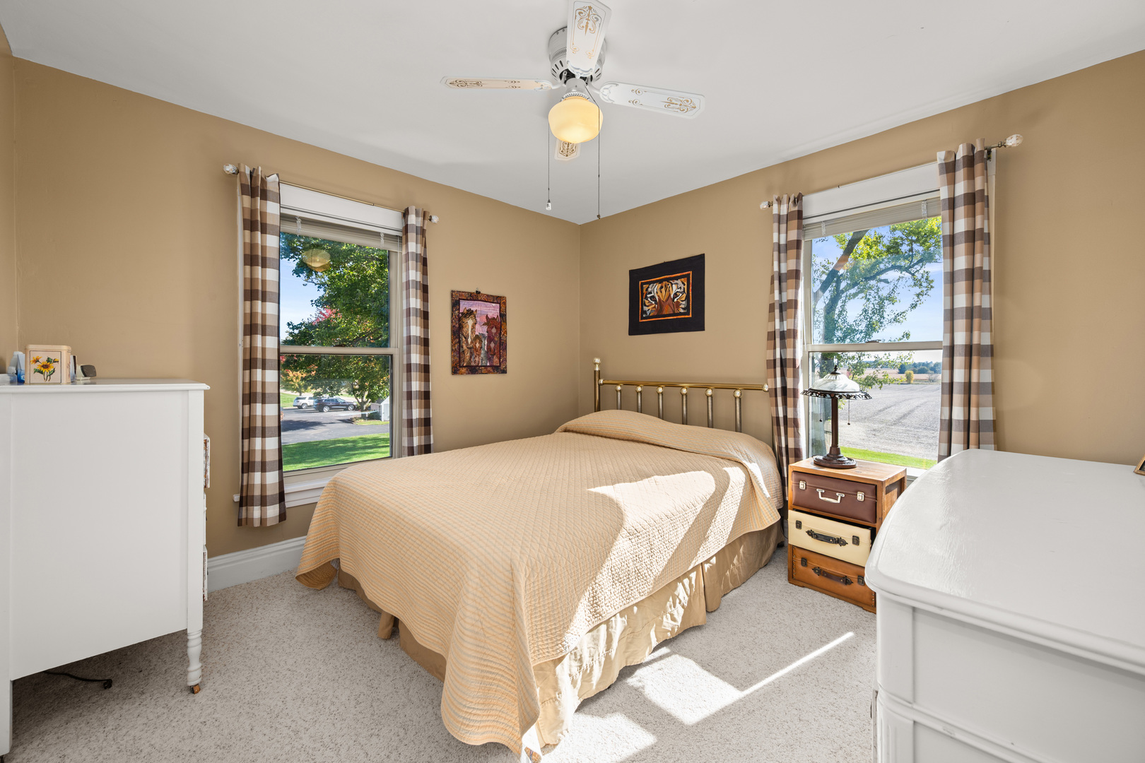 15165 Quigley Road Sycamore, IL 60178 - Photo 31 of 101 a bedroom with a bed lamps and window