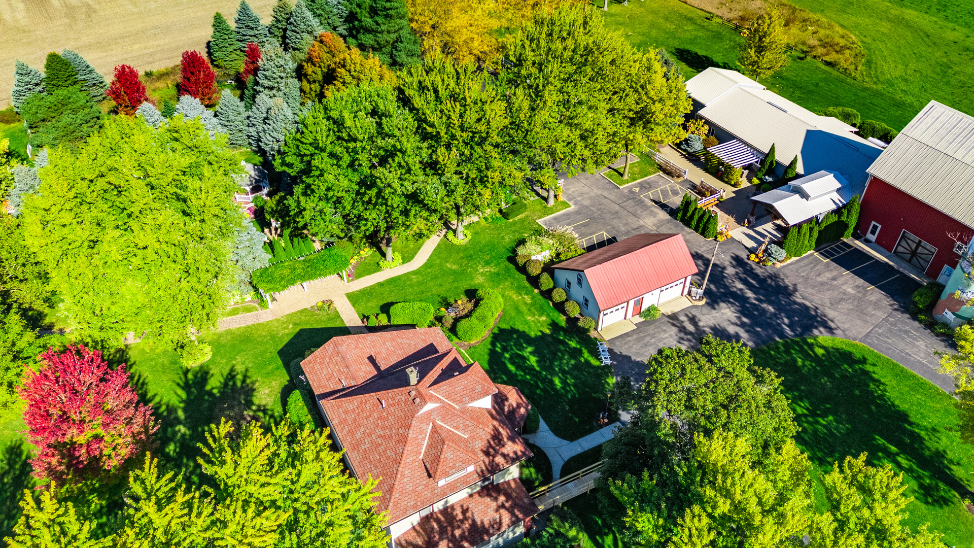 15165 Quigley Road Sycamore, IL 60178 - Photo 47 of 101 an aerial view of a house with a yard and garden