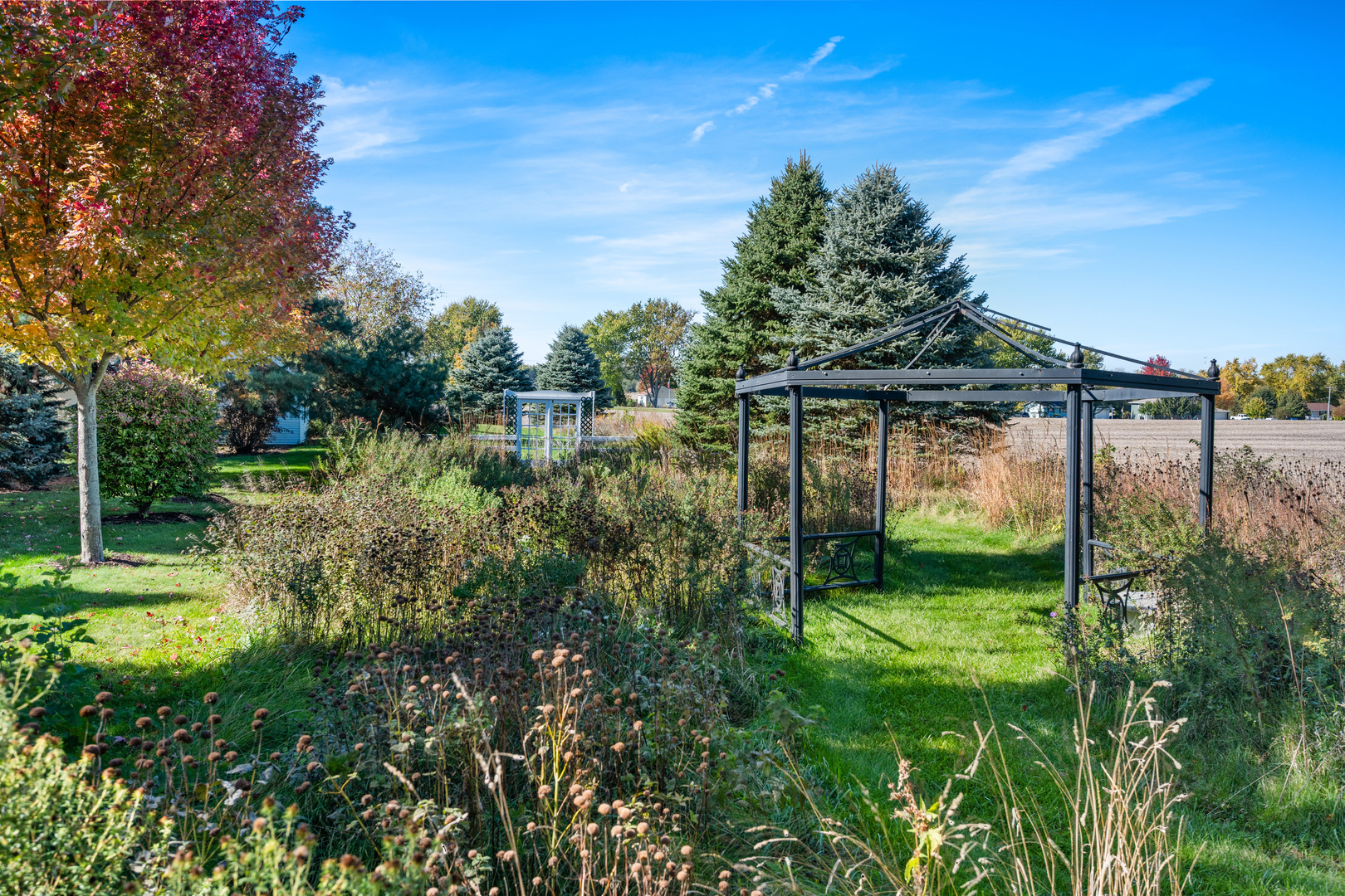 15165 Quigley Road Sycamore, IL 60178 - Photo 50 of 101 a view of a garden with a lake view