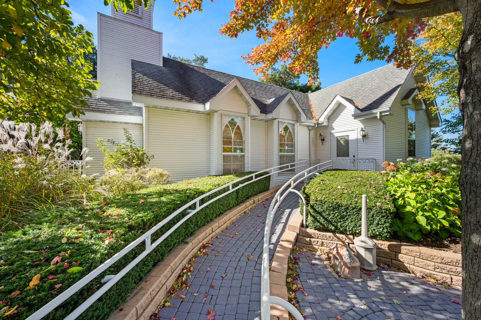 15165 Quigley Road Sycamore, IL 60178 - Photo 63 of 101 a view of a house with a small yard plants and a large tree