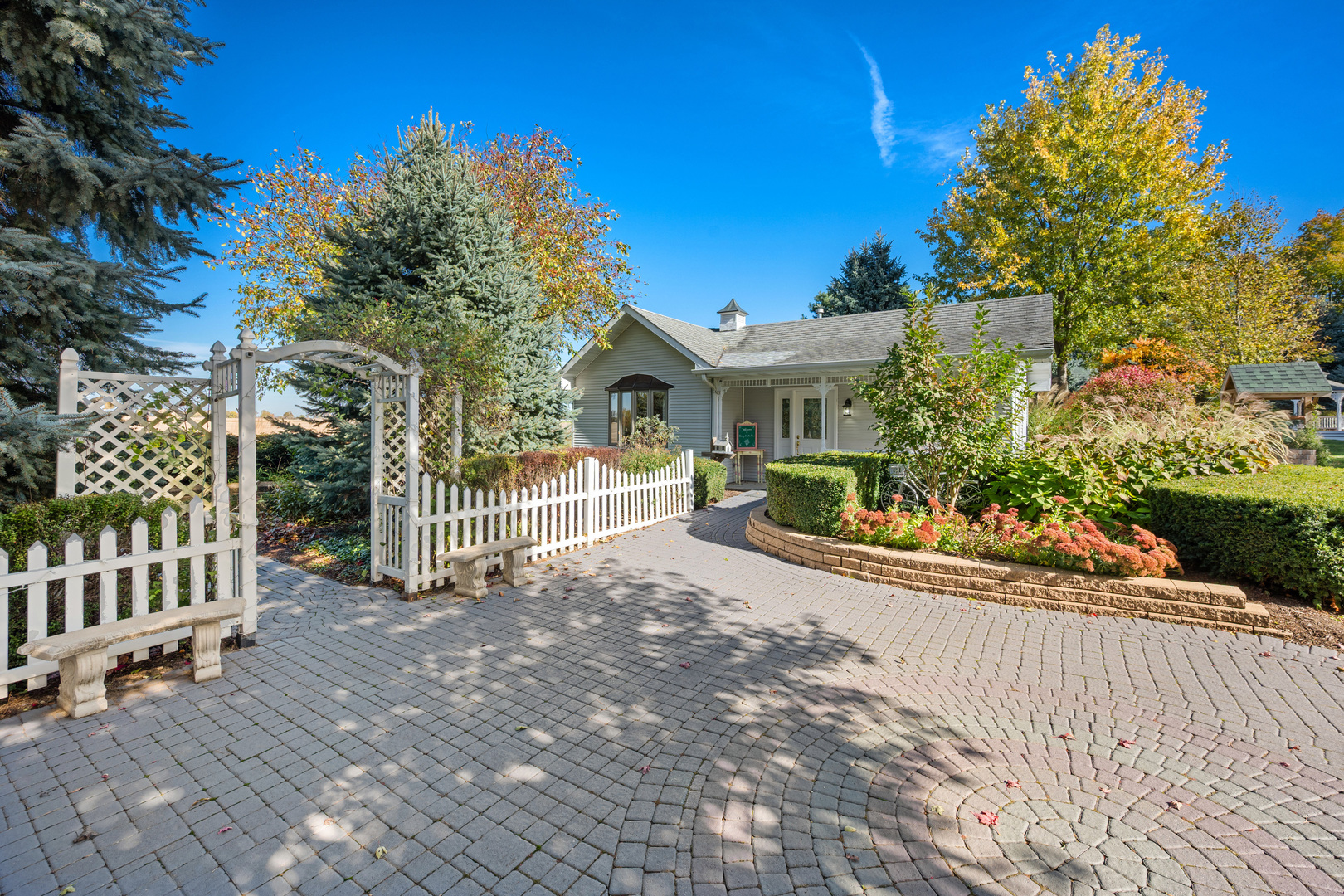 15165 Quigley Road Sycamore, IL 60178 - Photo 65 of 101 a view of a house with a small yard and plants
