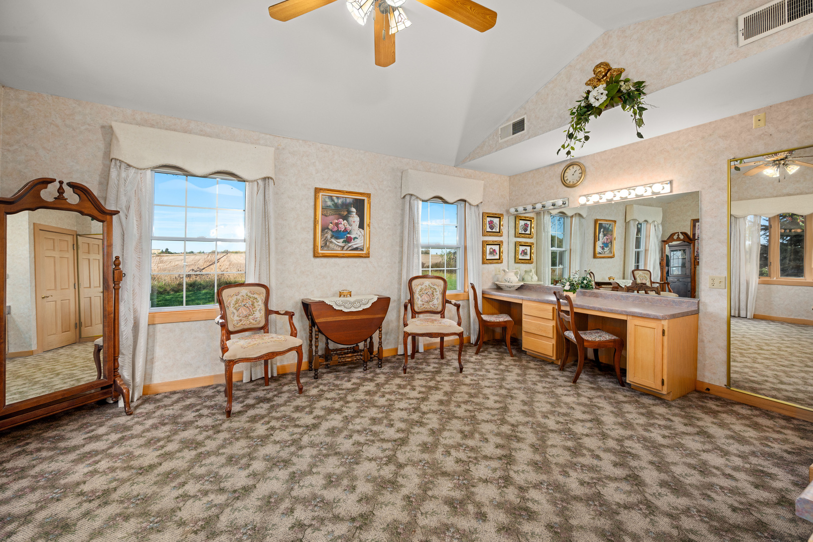 15165 Quigley Road Sycamore, IL 60178 - Photo 66 of 101 a living room with furniture a rug and white walls