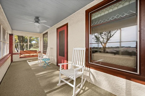 a kitchen with stainless steel appliances kitchen island granite countertop a refrigerator a stove and a sink with wooden floor