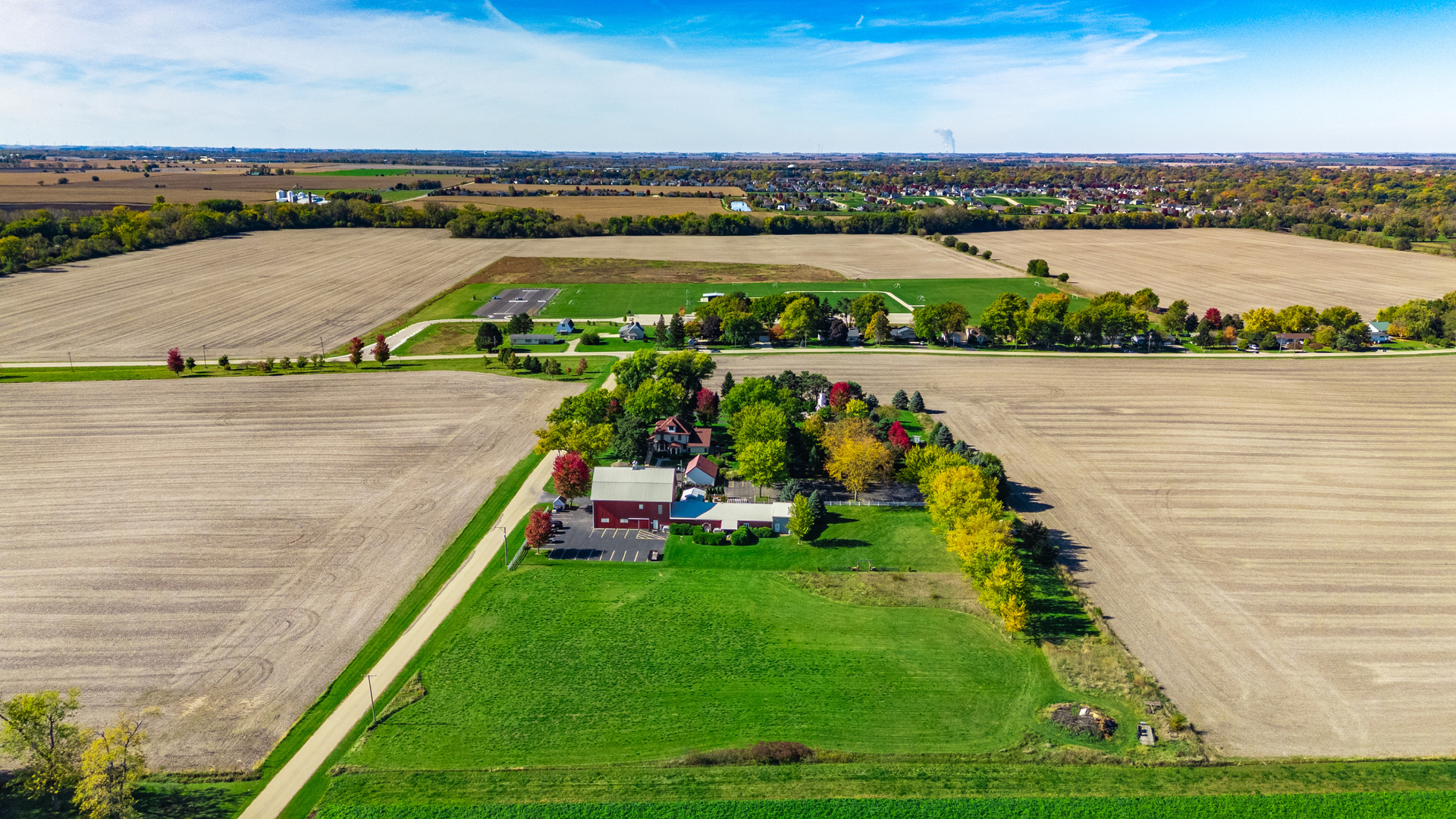 15165 Quigley Road Sycamore, IL 60178 - Photo 99 of 101 an aerial view of a house with a garden and lake view