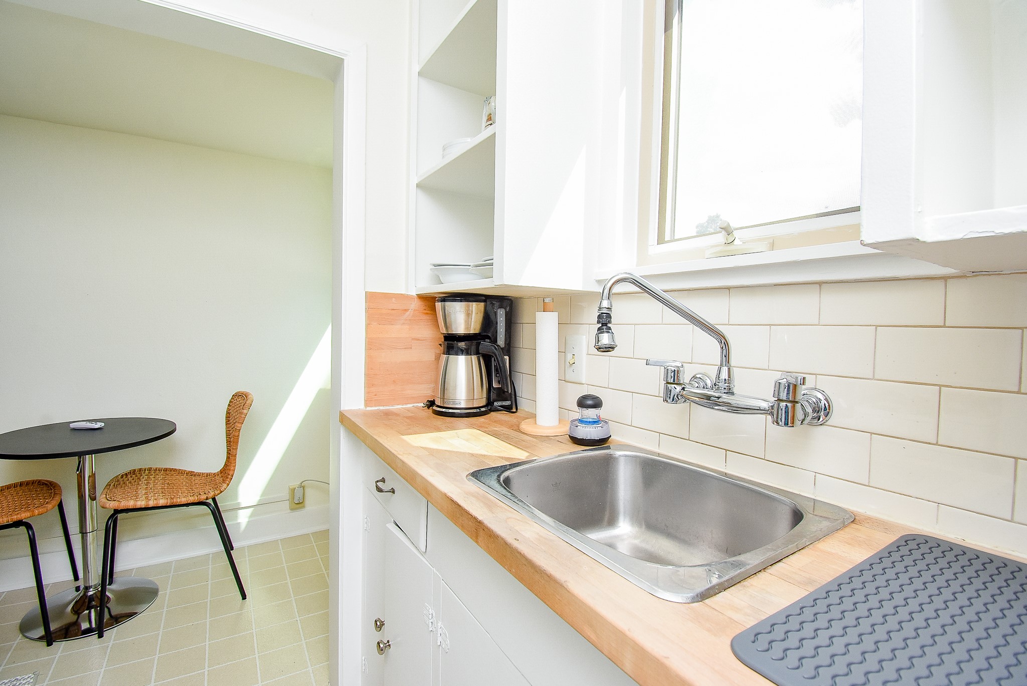 1313 Peden Street Houston, TX 77006 - Photo 18 of 33 a kitchen with a sink and a refrigerator